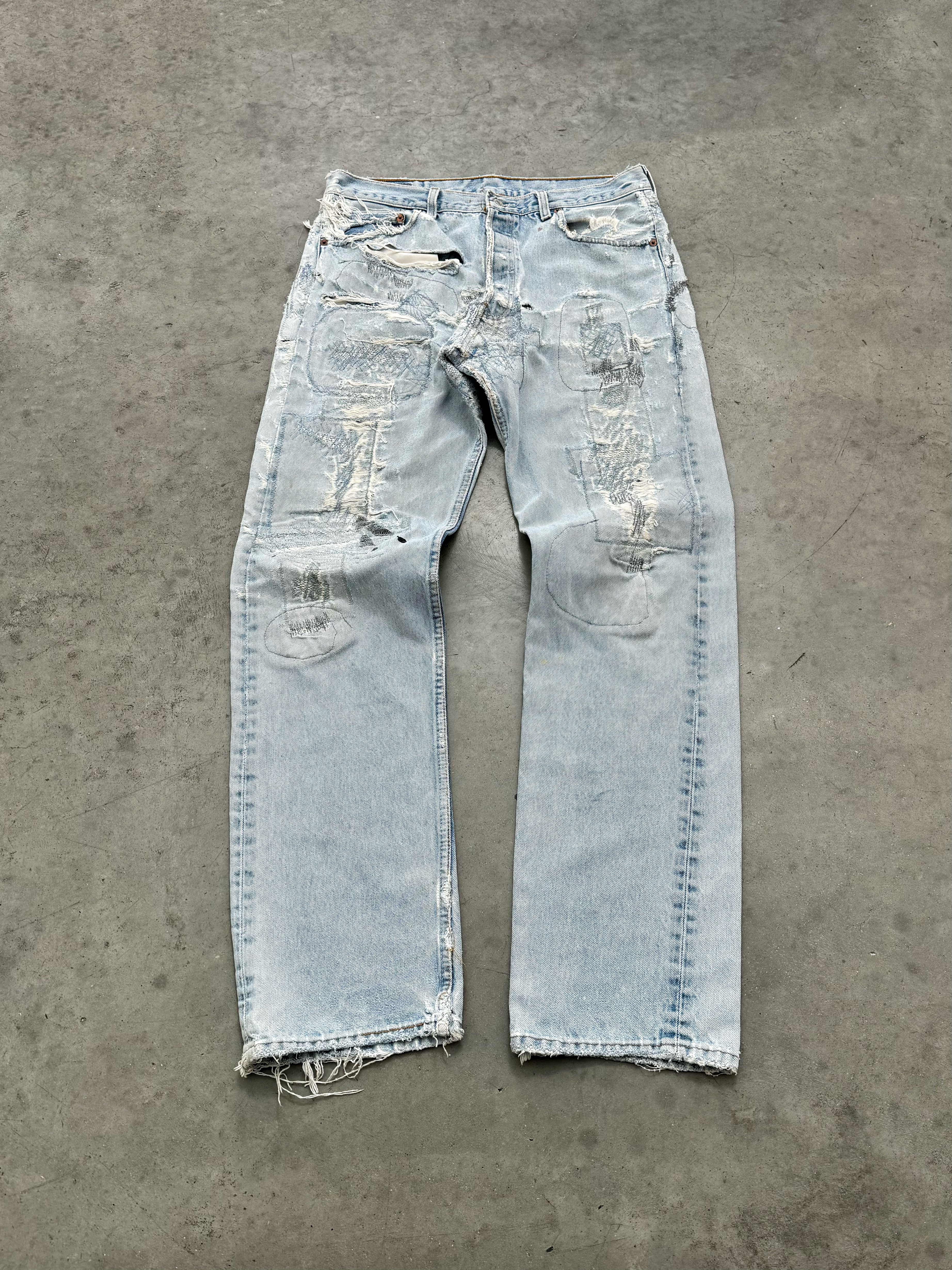 DISTRESSED FADED BLUE LEVIS REPAIR JEANS - 1990S
