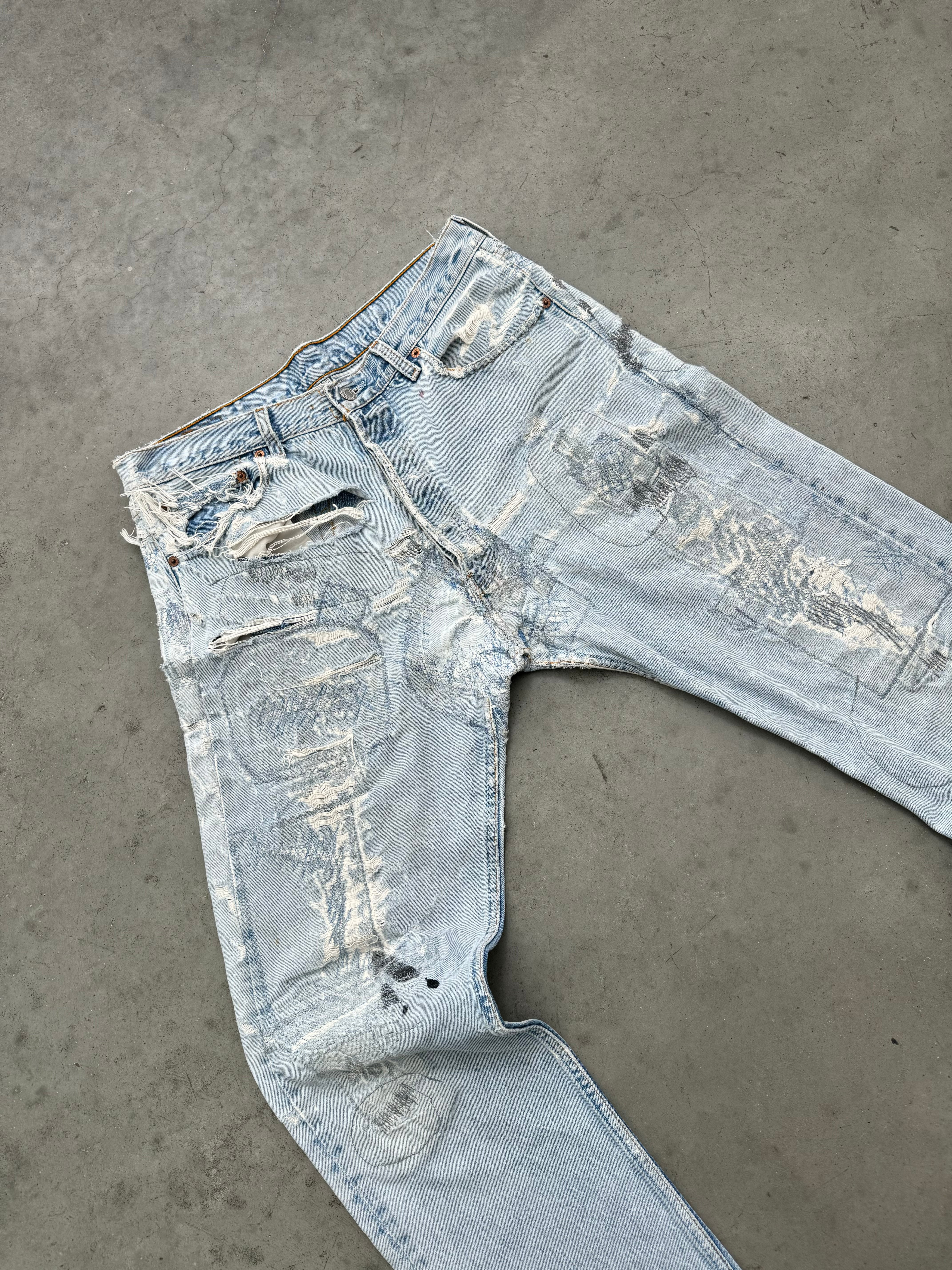DISTRESSED FADED BLUE LEVIS REPAIR JEANS - 1990S