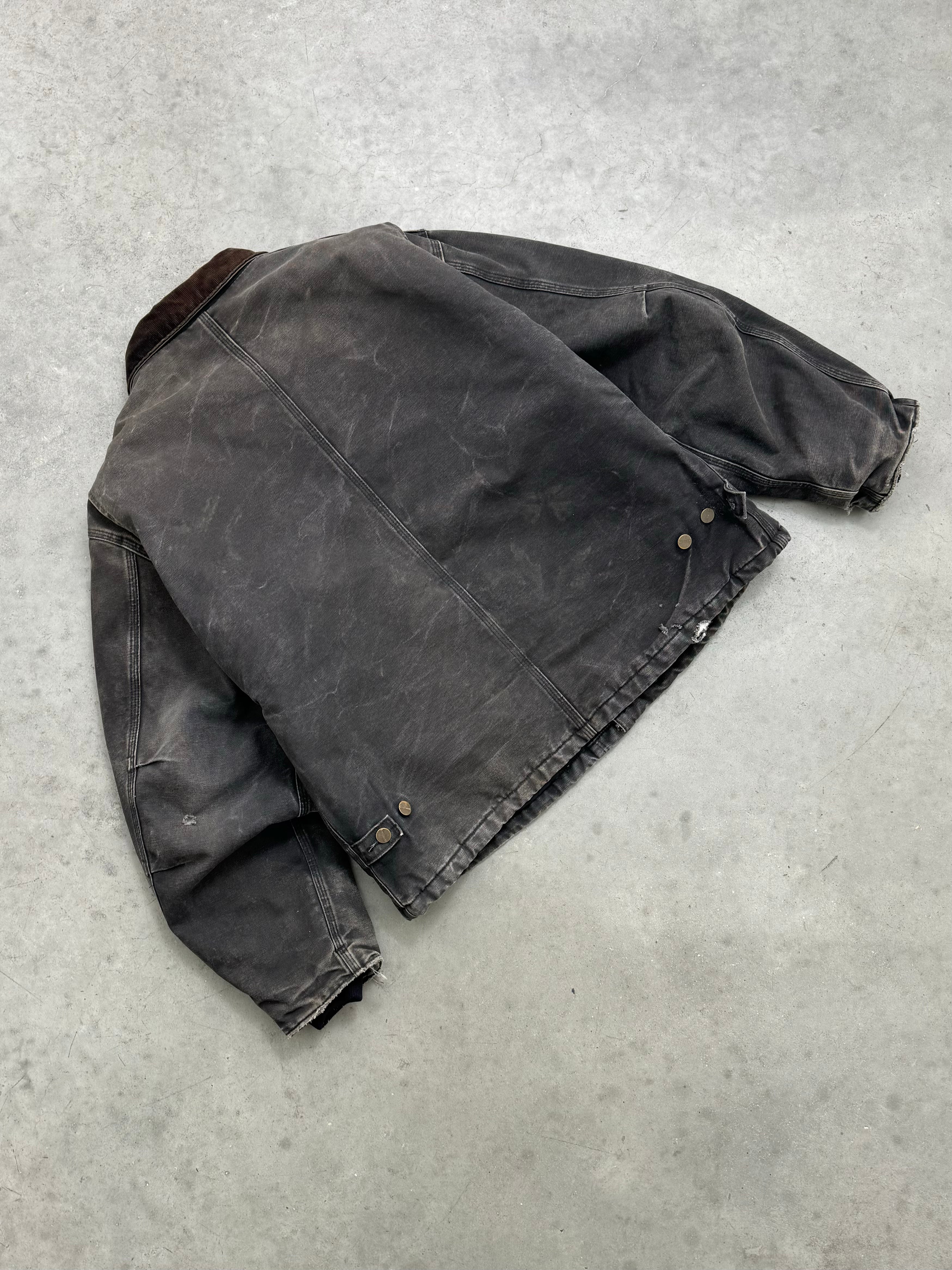 FADED BLACK AND DISTRESSED CARHARTT JACKET - 1990S