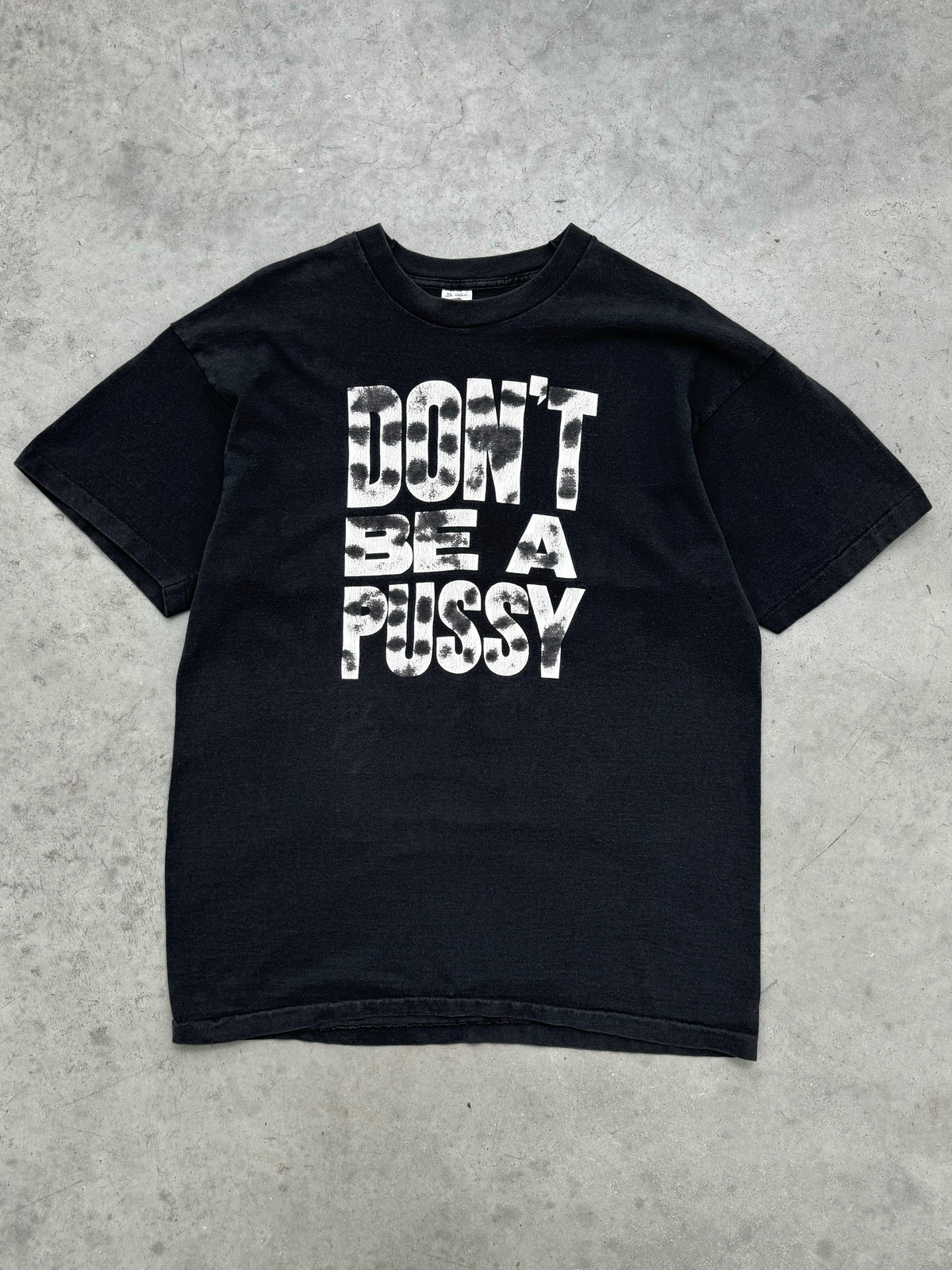 “DON'T BE A PUSSY” FADED BLACK TEE - 1990S