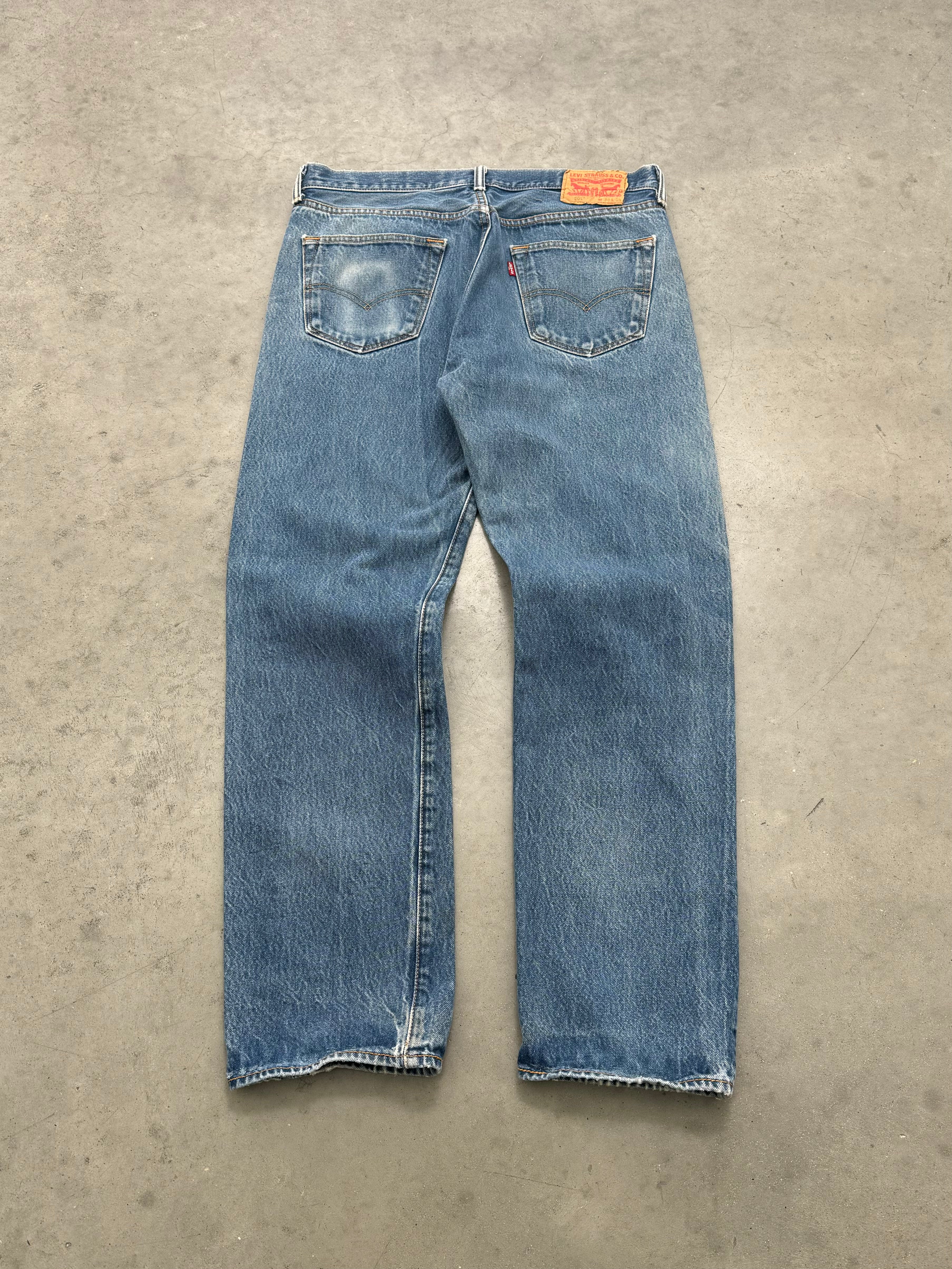DISTRESSED & FADED BLUE LEVIS PATCHWORK JEANS - 2000S