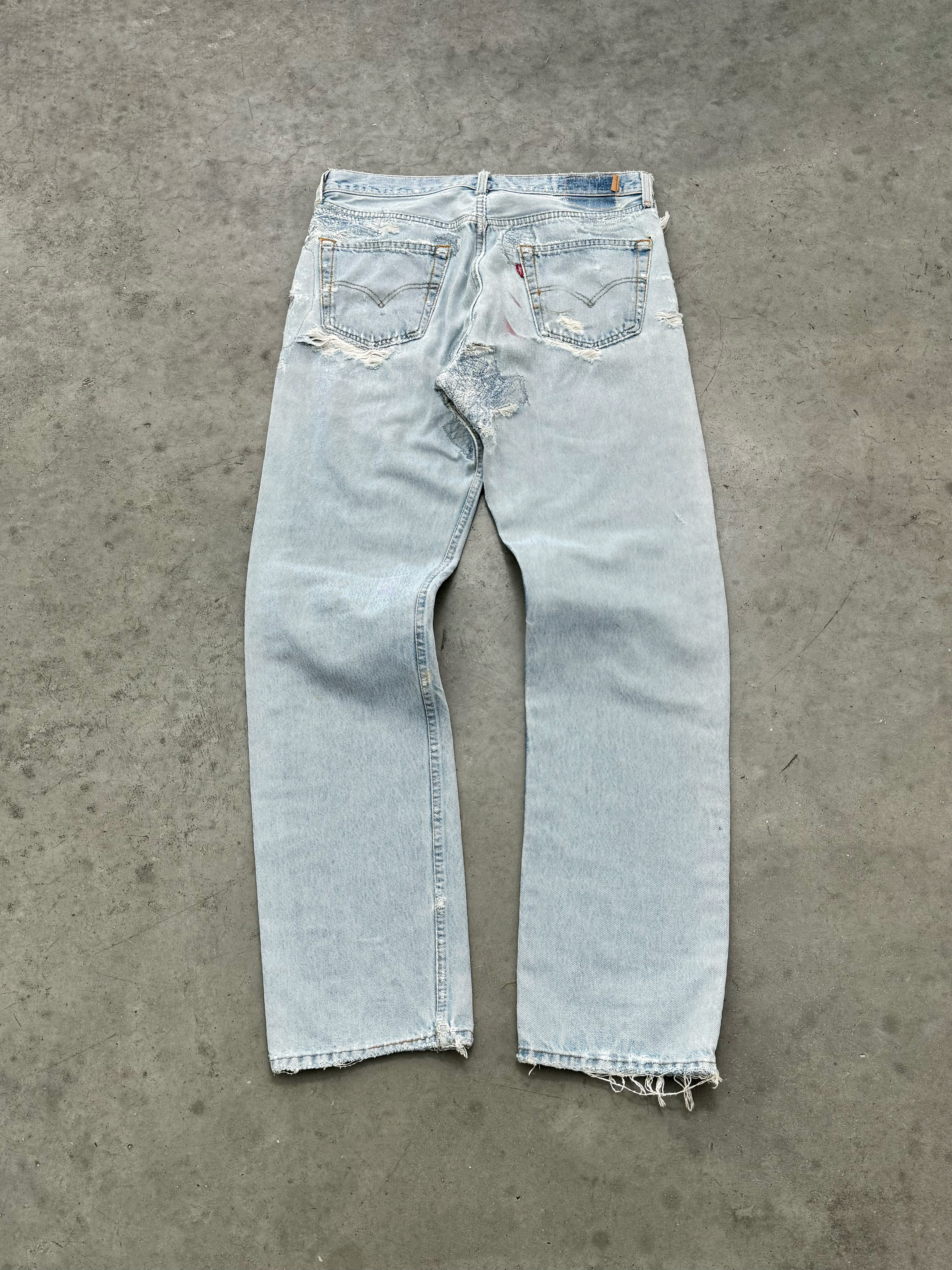 DISTRESSED FADED BLUE LEVIS REPAIR JEANS - 1990S