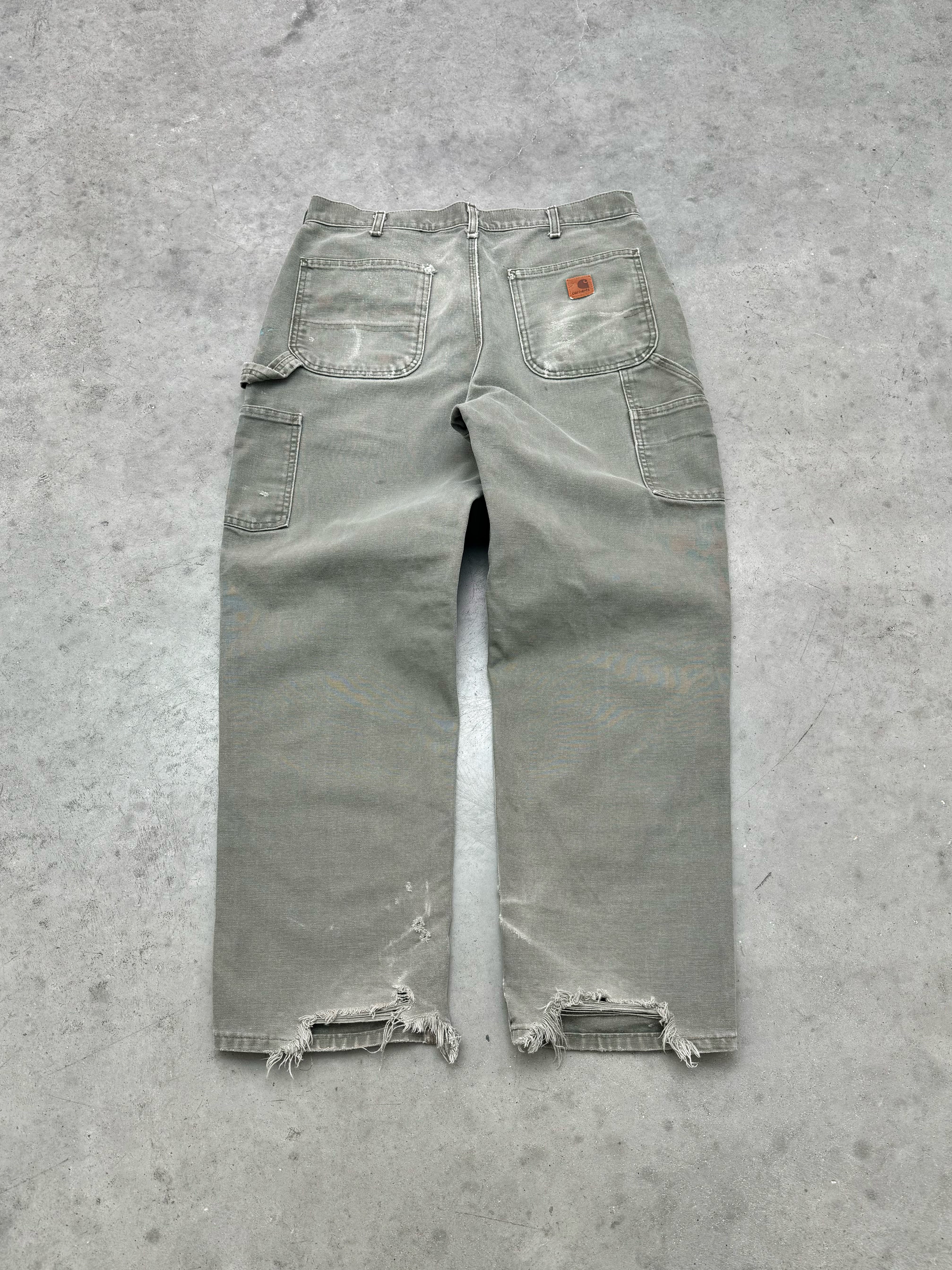 SUN FADED & DISTRESSED OLIVE CARHARTT PANTS - 2000S